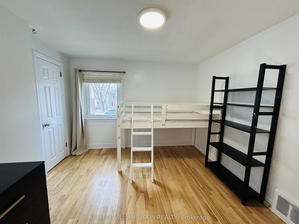 Warm luxury vinyl flooring in a finished loft bedroom